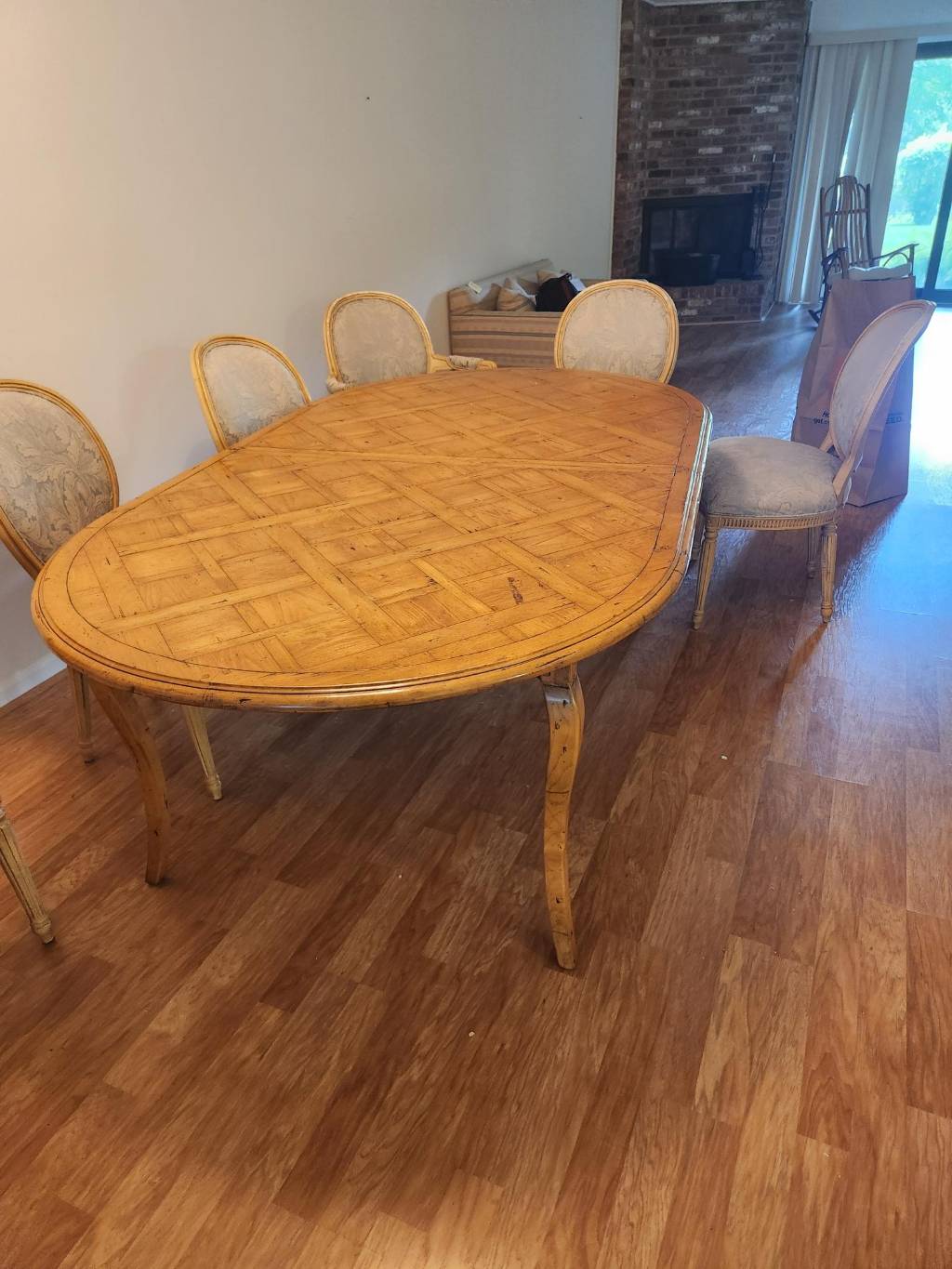 1970 French Provincial style parquet table with extension leaf, made by Guy Chaddock; 8 chairs for table (or separate) in similar French Style, manufactured by Hickory Chairs
