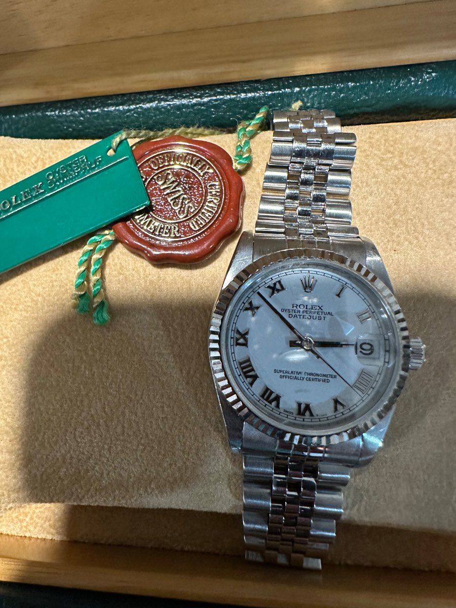 Rolex Oyster Perpetual Datejust — Silver Roman Numeral Dial with Original Rolex Tag & Seal